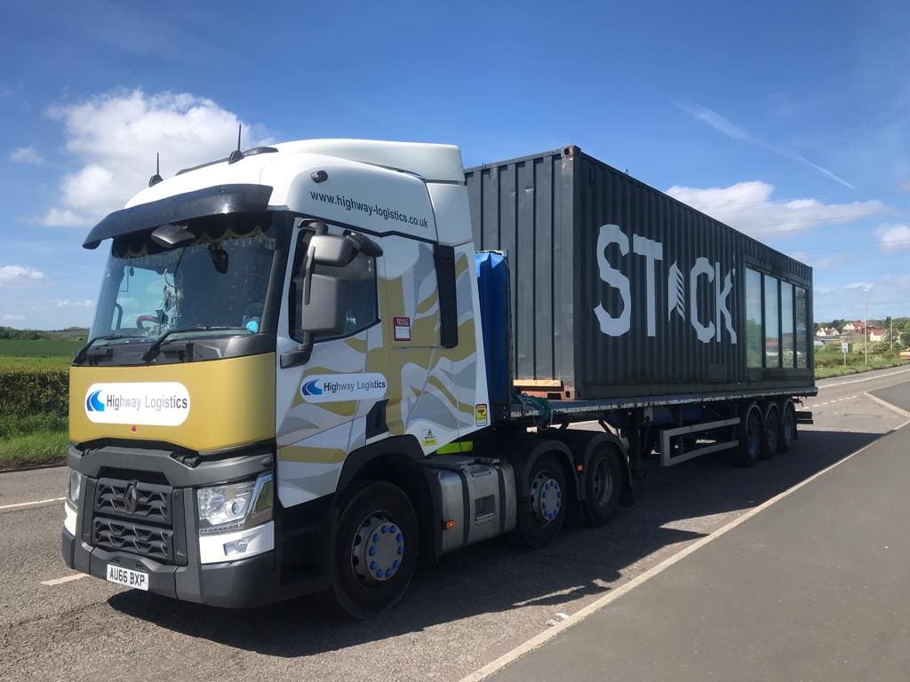 a hgv truck with container on the trailer